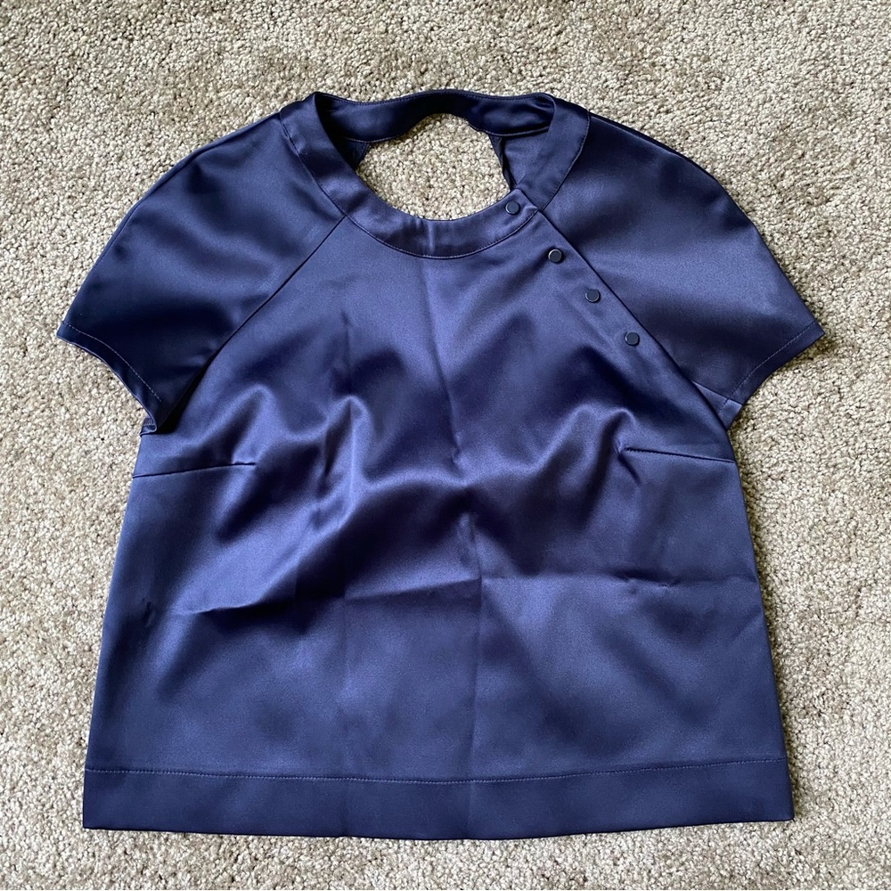 Satin open back blouse.